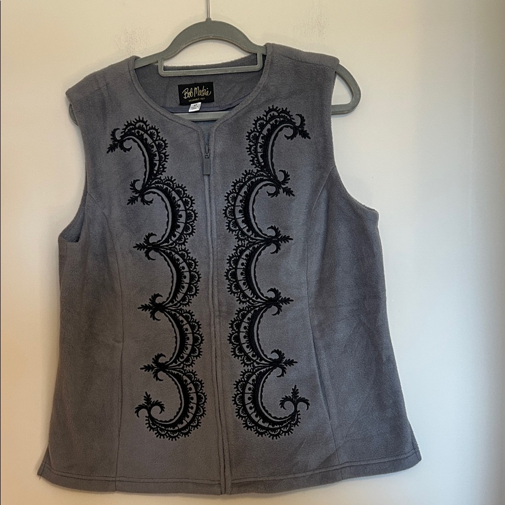 Bob Mackie grey fleece with black trim vest in very good condition size M